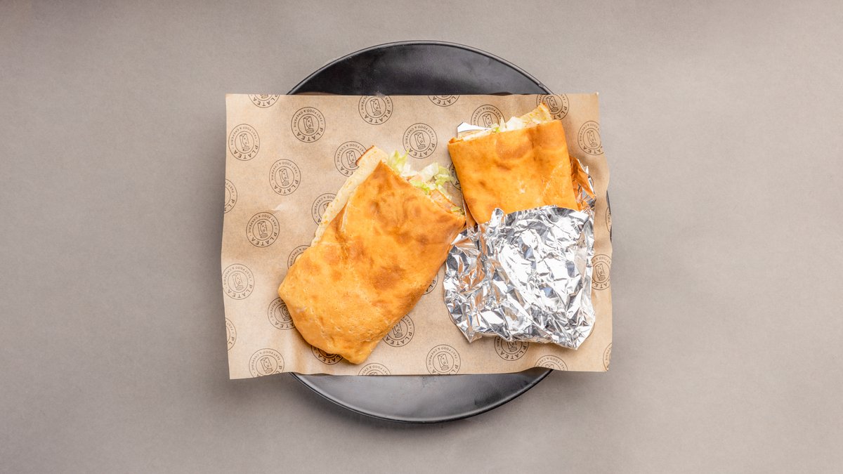 Pita Pita – Guda and cheddar cheese, chicken or pork, tomatoes, green sa...